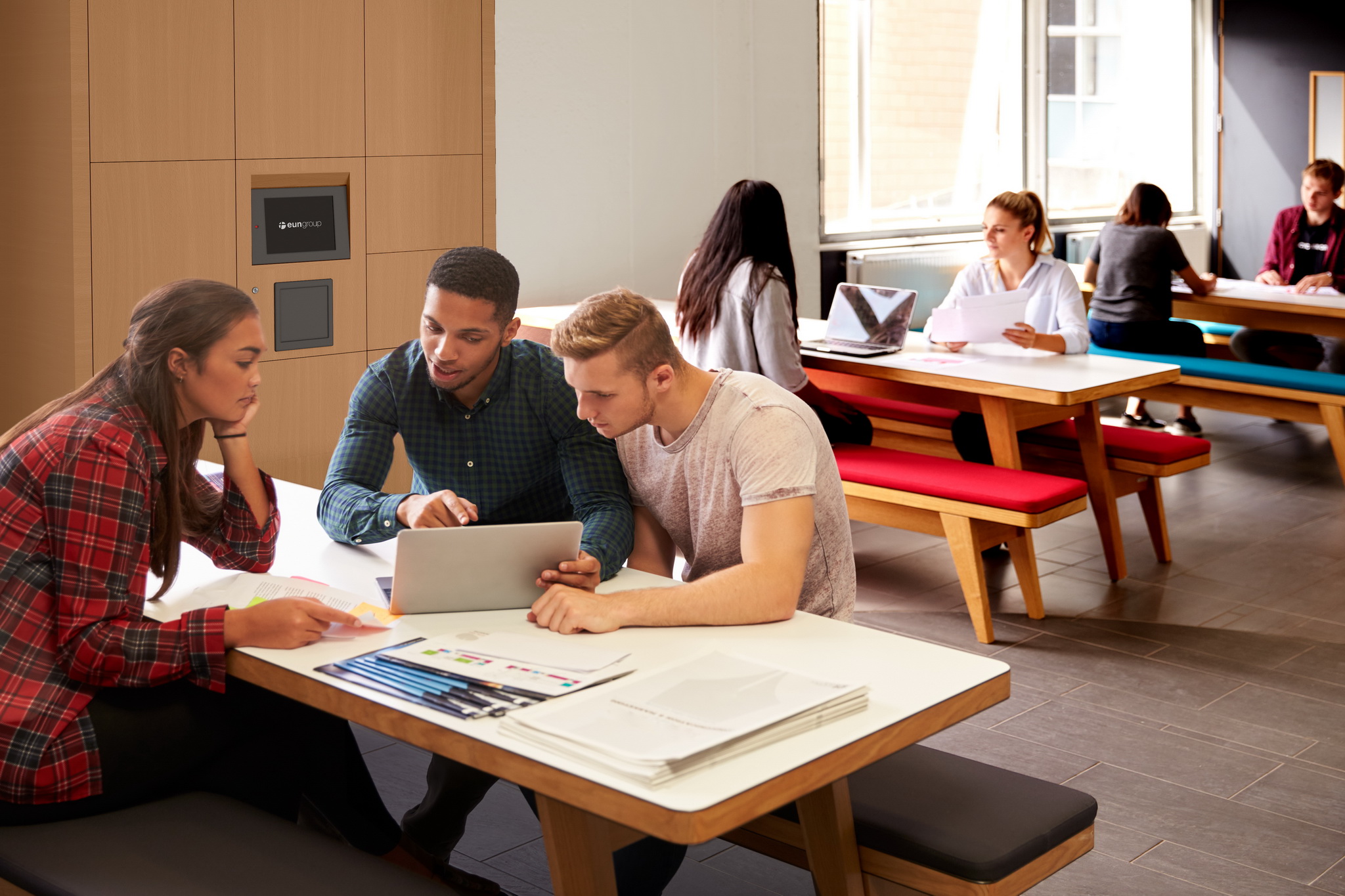 Group Of University Students Working In Study Room